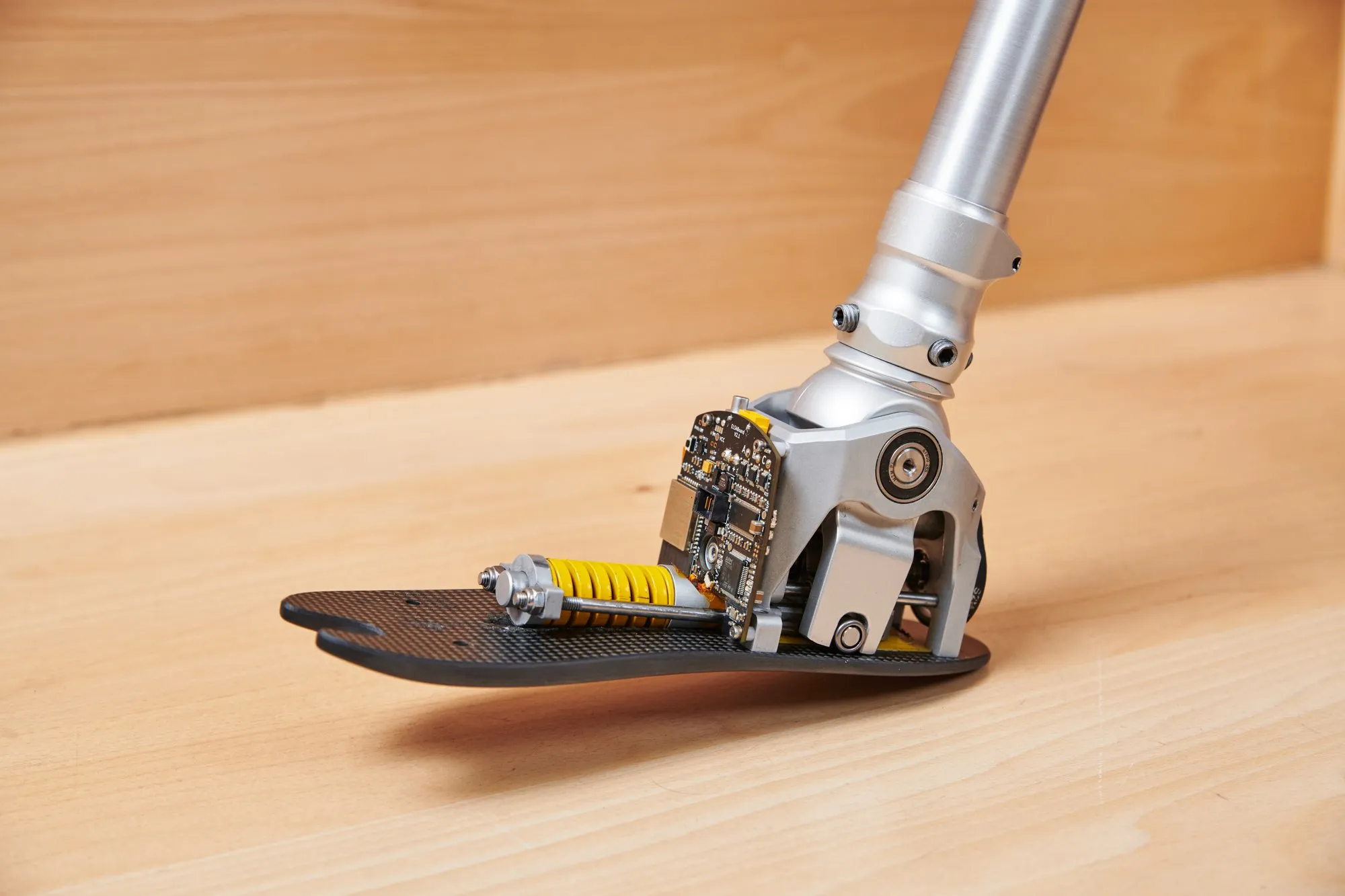 ELSA prosthesis with its cover removed, showing the actuator, spring and electronics integrated in the foot